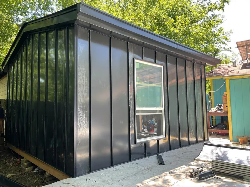 Black standing seam metal wall panels for Roof Inspection in Homeland